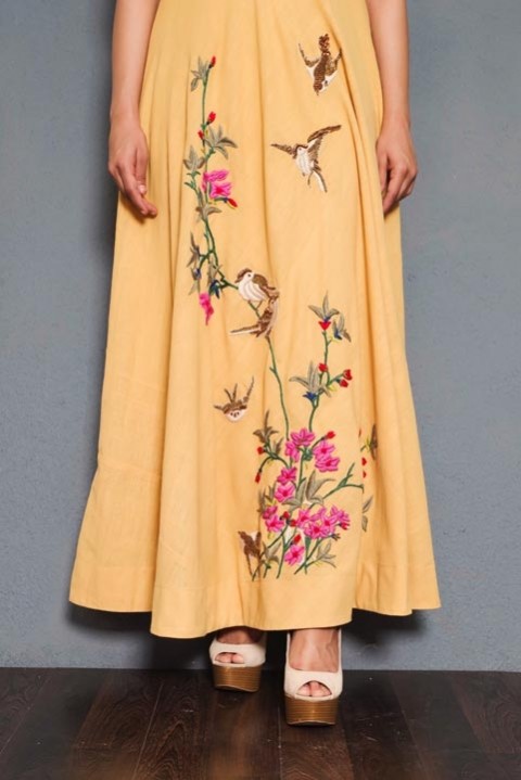 Yellow Handwoven mirror and hand embroidered dress